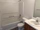 Full bathroom with white vanity, sink, toilet, and a bathtub with a shower at 111 Shadow Bend Ln, Selma, NC 27576