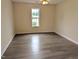 Spacious bedroom featuring neutral walls, updated flooring, and a ceiling fan at 111 Shadow Bend Ln, Selma, NC 27576