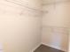 Walk-in closet featuring wire shelving for organized storage and gray flooring at 111 Shadow Bend Ln, Selma, NC 27576
