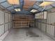 A garage with shelving and a workbench with lots of space at 111 Shadow Bend Ln, Selma, NC 27576