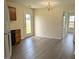 Open-concept kitchen flowing into a dining area, featuring updated flooring at 111 Shadow Bend Ln, Selma, NC 27576