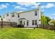 Expansive backyard featuring lush green lawn, white siding, and charming fenced in perimeter at 1121 Silky Dogwood Trl, Apex, NC 27502