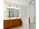 Bright bathroom features dual sinks, soaking tub, and glass shower enclosure at 1121 Silky Dogwood Trl, Apex, NC 27502