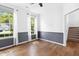 Bright bedroom features large windows, wood floors, and neutral paint, creating a serene atmosphere at 1121 Silky Dogwood Trl, Apex, NC 27502