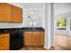 Cozy kitchen with wood cabinets and granite countertops, seamlessly connected to the bright living spaces at 1121 Silky Dogwood Trl, Apex, NC 27502