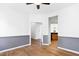 Spacious living room with hardwood floors, neutral color scheme, and open layout to dining, perfect for entertaining at 1121 Silky Dogwood Trl, Apex, NC 27502