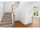 Carpeted staircase with wood railing and banister at 1121 Silky Dogwood Trl, Apex, NC 27502