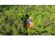 Aerial view showing a home nestled amongst trees with a private driveway at 118 Chanute Cir, Louisburg, NC 27549