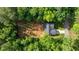 Aerial view of the home surrounded by lush greenery and mature trees at 118 Chanute Cir, Louisburg, NC 27549