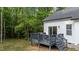 Back of house with deck overlooking lawn at 118 Chanute Cir, Louisburg, NC 27549