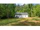 Back of the house with a private backyard at 118 Chanute Cir, Louisburg, NC 27549
