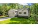 Front of house with landscaped yard and attached garage at 118 Chanute Cir, Louisburg, NC 27549