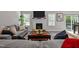 Cozy living room with a fireplace, neutral paint, and an open concept layout perfect for relaxation at 118 Chanute Cir, Louisburg, NC 27549