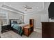 Spacious main bedroom with a trey ceiling, a ceiling fan, and cozy decor at 118 Chanute Cir, Louisburg, NC 27549