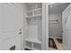 View of the mudroom with storage cubbies and coat hooks, leading to the laundry room at 118 Chanute Cir, Louisburg, NC 27549