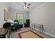 Functional office space with desk, computer setup, and ample storage solutions at 118 Chanute Cir, Louisburg, NC 27549