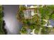 Aerial view of a luxurious property featuring a well-defined lot line, lake access, and manicured landscaping at 118 Duncansby Ct, Cary, NC 27511