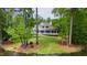 Home with a lush backyard and patio set near the lake at 118 Duncansby Ct, Cary, NC 27511