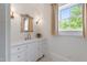 Elegant bathroom with white vanity, marble countertop, and natural light at 118 Duncansby Ct, Cary, NC 27511