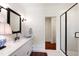 Elegant bathroom with a marble countertop, framed mirror, and glass-enclosed shower at 118 Duncansby Ct, Cary, NC 27511