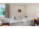 Marble tub, with brass fixtures, sits in a bright bathroom near a window at 118 Duncansby Ct, Cary, NC 27511