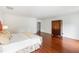 Spacious bedroom with hardwood floors and armoire at 118 Duncansby Ct, Cary, NC 27511