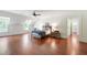 Primary bedroom features hardwood floors, architectural windows and ensuite access at 118 Duncansby Ct, Cary, NC 27511