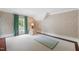 Open bedroom with floral wallpaper, and green drapes at 118 Duncansby Ct, Cary, NC 27511