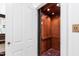 Interior of the wood paneled elevator with a patterned rug at 118 Duncansby Ct, Cary, NC 27511
