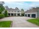 Stately two-story home features a balcony, large yard, and three car garage at 118 Duncansby Ct, Cary, NC 27511
