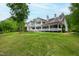 Stunning home with expansive lawn, covered porches, and mature trees at 118 Duncansby Ct, Cary, NC 27511