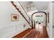 Bright foyer features wood floors, white walls, and a beautiful staircase at 118 Duncansby Ct, Cary, NC 27511