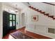 Elegant foyer features hardwood floors, staircase, and decorative rug at 118 Duncansby Ct, Cary, NC 27511