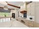 Large kitchen island with sink and countertops, and cooktop on adjacent counter at 118 Duncansby Ct, Cary, NC 27511