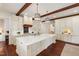 Bright kitchen showcasing a large island, gas cooktop, and ample cabinet space at 118 Duncansby Ct, Cary, NC 27511
