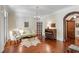 Living room with hardwood floors, a decorative fireplace, and plenty of space at 118 Duncansby Ct, Cary, NC 27511
