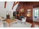 Spacious living room with a fireplace, exposed beams, and ample seating at 118 Duncansby Ct, Cary, NC 27511