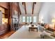 Spacious living room with a fireplace, exposed beams, and ample seating at 118 Duncansby Ct, Cary, NC 27511