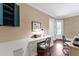 Office space with cream wallpaper and a large built in desk area with storage at 118 Duncansby Ct, Cary, NC 27511