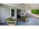 Inviting covered porch with comfortable seating and charming exterior views at 118 Duncansby Ct, Cary, NC 27511