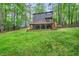 Expansive backyard featuring a large deck perfect for outdoor entertaining and enjoying the serene surroundings at 121 Ladybug Ln, Chapel Hill, NC 27516
