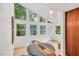 Bright dining area with large windows offering views of the outdoors at 121 Ladybug Ln, Chapel Hill, NC 27516