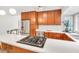 Modern kitchen featuring light countertops, stainless steel appliances, and wooden cabinets at 121 Ladybug Ln, Chapel Hill, NC 27516