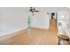 Bright and open living space with wood floors, stairs to the upper level, and access to outdoor space at 121 Ladybug Ln, Chapel Hill, NC 27516