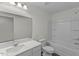 Bathroom featuring vanity with sink, toilet, and shower-tub combination at 1215 Pond Overlook Drive, Nashville, NC 27856