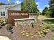 Landscaped Cardinal Woods community sign with stone accents and manicured flowerbeds on a sunny day at 1215 Pond Overlook Drive, Nashville, NC 27856