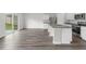 Open floorplan with a granite kitchen island with stainless steel appliances at 1215 Pond Overlook Drive, Nashville, NC 27856