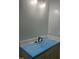 New bathroom vanity with black fixtures and modern countertop with protective wrap at 123-125 Ottawa Dr., Louisburg, NC 27549
