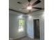 This bedroom features a modern ceiling fan, recessed lighting, and a bright window at 123-125 Ottawa Dr., Louisburg, NC 27549