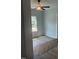Bedroom with light-filled windows, new floors, and modern ceiling fan at 123-125 Ottawa Dr., Louisburg, NC 27549